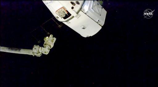 In this image taken from NASA Television, the SpaceX Dragon cargo spacecraft approaches robotic arm for docking to the International Space Station, Saturday, Dec. 8, 2018. A SpaceX delivery full of Christmas goodies has arrived at the International Space Station. The Dragon capsule pulled up at the orbiting lab Saturday, three days after launching from Florida. [Photo: AP/ NASA TV]