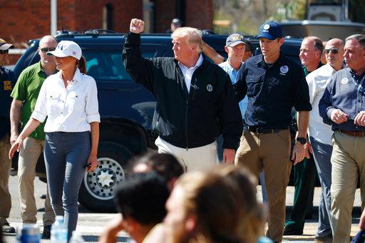 President Donald Trump and first lady Melania Trump tour areas affected by Hurricane Michael, Monday, Oct. 15, 2018, in Lynn Haven, Fla. [Photo: AP/Evan Vucci]